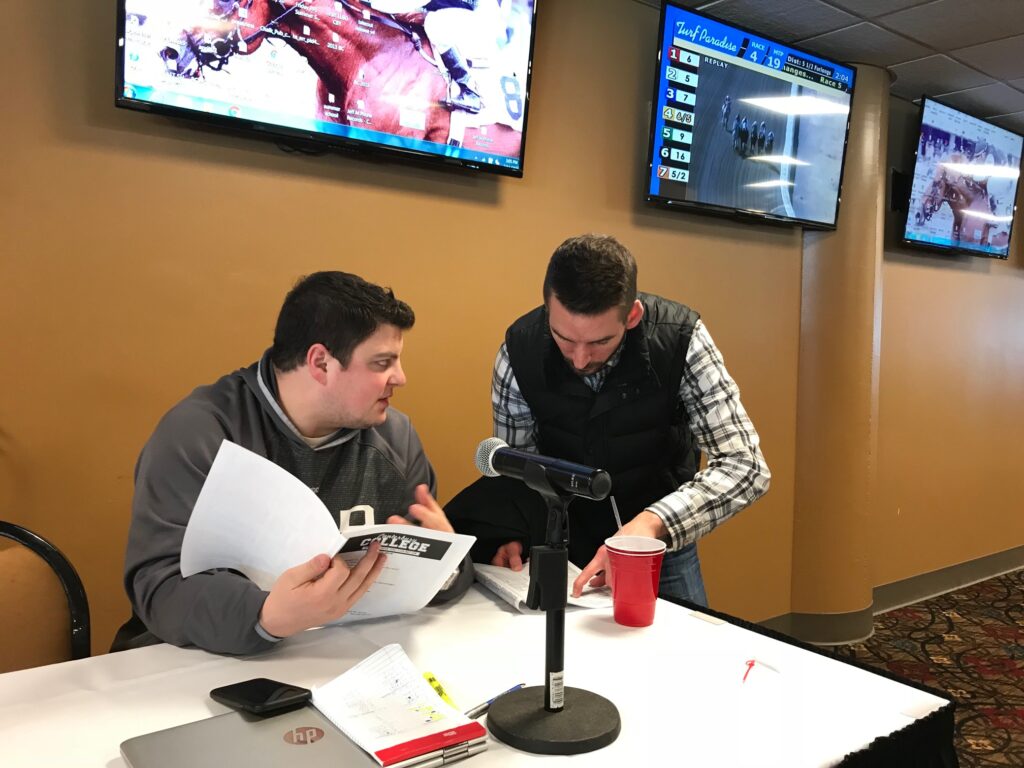 Brian Arrigoni, Paddock analyst at Canterbury Park, speaks with a student during Week 1 of Canterbury College.